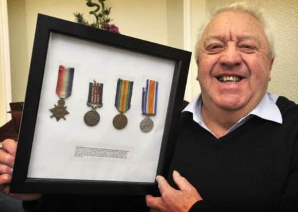 140221
Harold Burnley with his namesake relatives World War 1 medals
Picture by Neil Silk
09/01/14