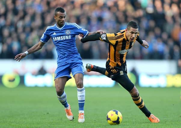 Hull City's Jake Livermore (right) and Chelsea's Ashley Cole (left) battle for the ball.
