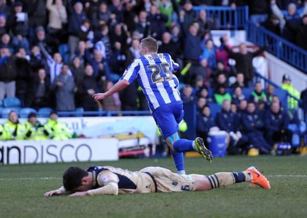 Sheffield Wednesday's Caolan Lavery turns to celebrate after scoring his side's fifth goal as Leeds United's Alex Mowatt cannot look