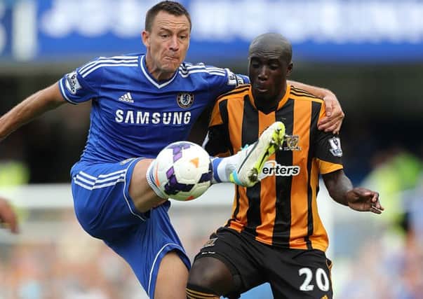 Hull City's Yannick Sagbo and Chelsea's John Terry battle for the ball