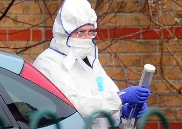 A forensic officer at the scene in Lincoln Green,Leeds. Picture by Tony Johnson