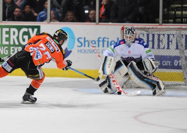 TAKE THAT: Robert Dowd fires home the overtime winner that sealed a 5-4 triumph for Sheffield Steelers' over Coventry Blaze on Saturday night. Picture: Dean Woolley.