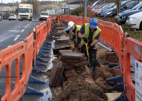 Workers laying fibre optic cable on Sheffield Road, Rotherham during the failed Digital Region project