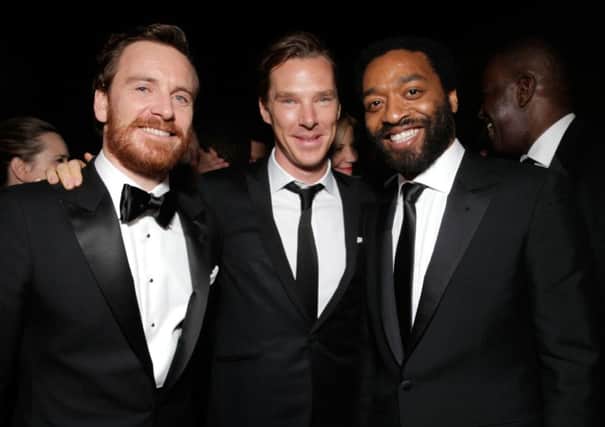From left, Michael Fassbender, Benedict Cumberbatch, and Steve McQueen winner of Best Motion Picture - Drama for '12 Years a Slave,'