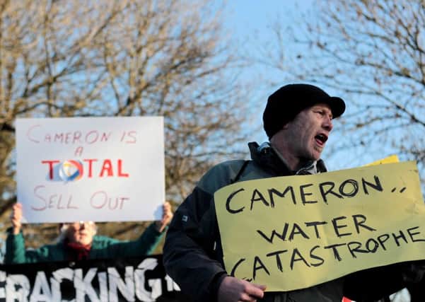 Demonstrators block the entrance to an I Gas shale drilling plant oil depot near Gainsborough, Lincolnshire during a visit by Prime Minster David Cameron.