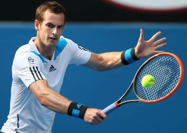 Andy Murray of Britain makes a backhand return to Go Soeda of Japan during their first round match at the Australian Open. (AP Photo/Rick Rycroft)
