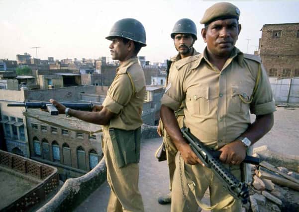 1984: Indian troops take up position on rooftops around the Golden Temple, in Amritsar