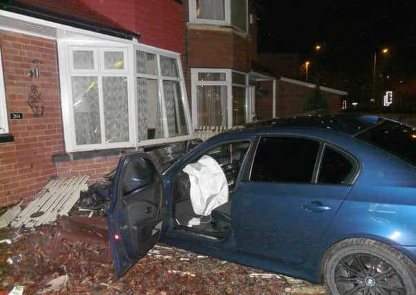The car which crashed into a house on Stainbeck Road, Leeds. Picture by Neil O'Malley.