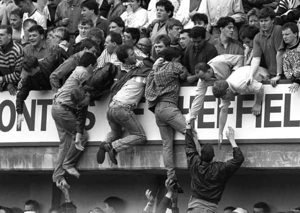 Liverpool fans trying to escape overcrowding at Hillsborough in 1989