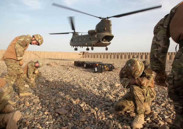 A Chinook makes a delivery at Patrol Base Attal in Helmand Province, Afghanistan.