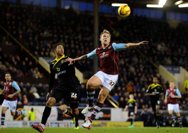 Burnley's Scott Arfield battles for the ball with Sheffield Wednesday's Liam Palmer.