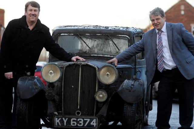 Auctioneer Gary Don and owner Martin Hunt with a 1934 Triumph Gloria