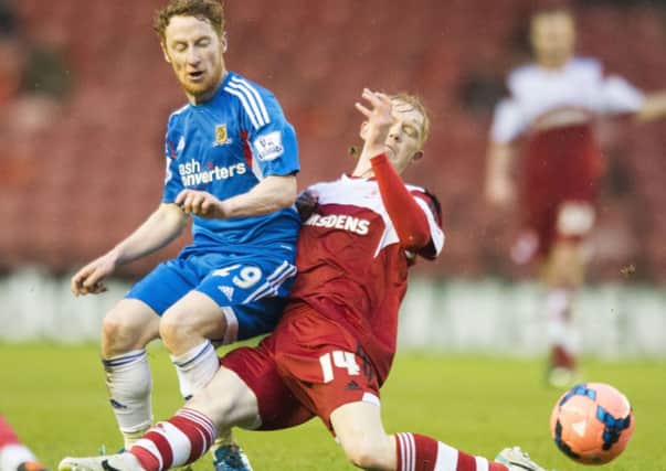 Middlesbrough's Luke Williams (right), a target for Sheffield United, challenges Hull City's Stephen Quinn (left).