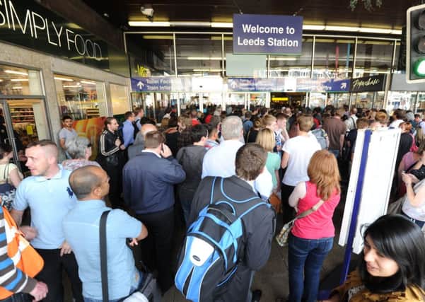 Passengers queuing at Leeds Station