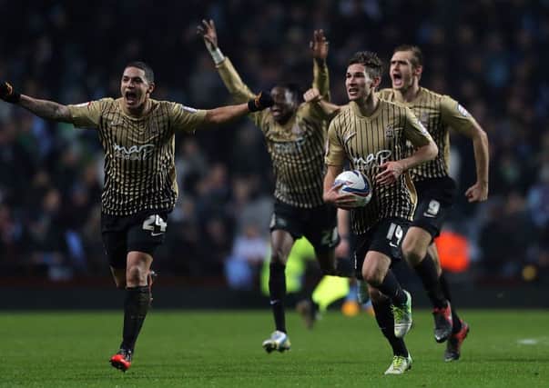 Bradford City's Nathan Doyle, Will Atkinson and James Hanson celebrate after the game during the Capital One Cup, Semi Final, Second Leg match at Villa Park, Birmingham.