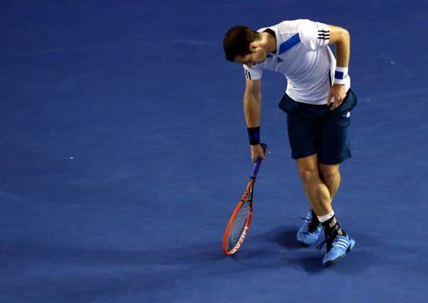 Andy Murray of Britain reacts after losing a point to Roger Federer of Switzerland during their quarter-final at the Australian Open  in Melbourne. (AP Photo/Eugene Hoshiko)