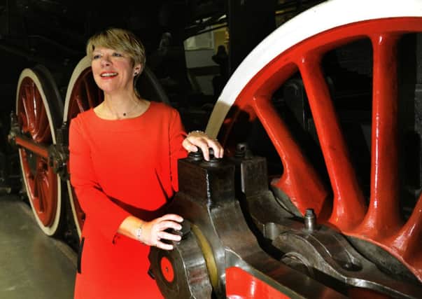 Jane Lady Gibson, chairman of Visit York in front of the Chinese locomotive KF7 at the National Railway Museum