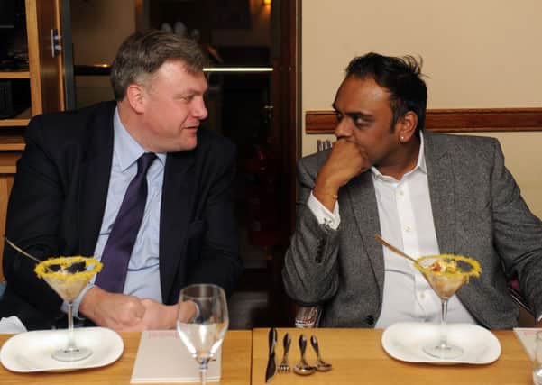 Ed Balls chats with Bobby Patel from Prashads at a Goldman Sachs roundtable event held at Prashad restaurant in Leeds