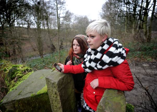 Jess Chippendale, right, and sister Olivia Chippendale taking part in a geocaching search in Pudsey.