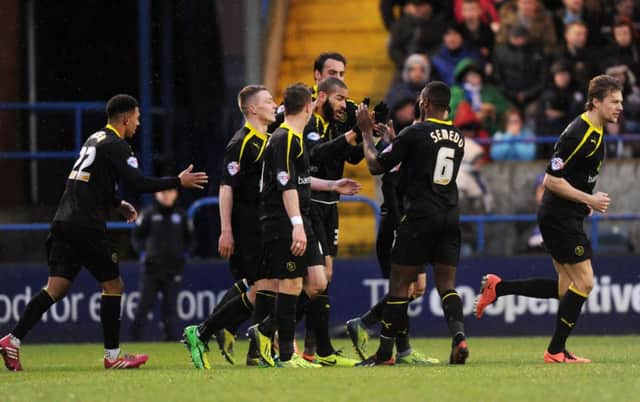 GOING THROUGH: Sheffield Wednesday and Oguchi Onyewu celebrate his goal at Spotland on Saturday. The Owls now face Charlton Athletic in the fifth round.  Picture Bruce Rollinson