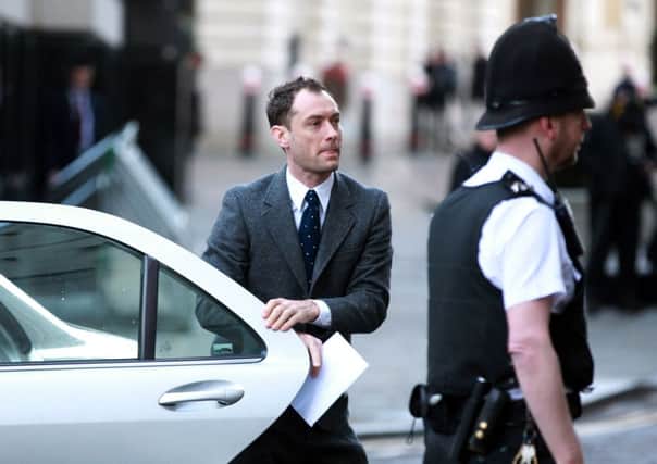 Jude Law arrives at the Old Bailey in London to take the witness box in the phone-hacking trial.