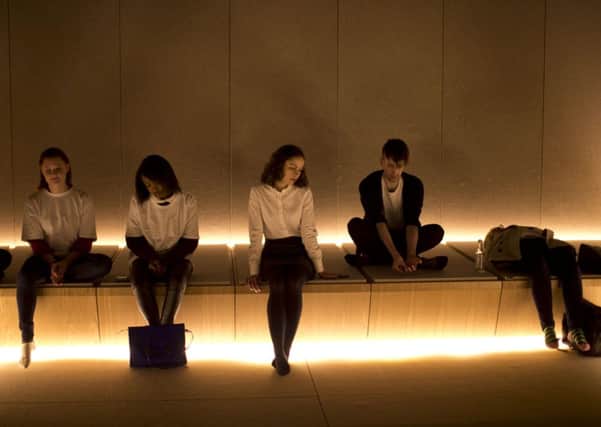 Volunteers and employees of Selfridges department store on Oxford Street in London, pose for the media in "The Silence Room", a space they unveiled for shoppers to quietly relax in, and Dr Steve Taylor, below.