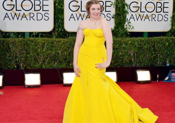 Lena Dunham arrives at the 71st annual Golden Globe Awards