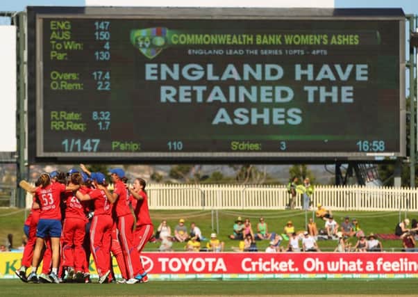 England celebrate after winning the match and retaining the Ashes