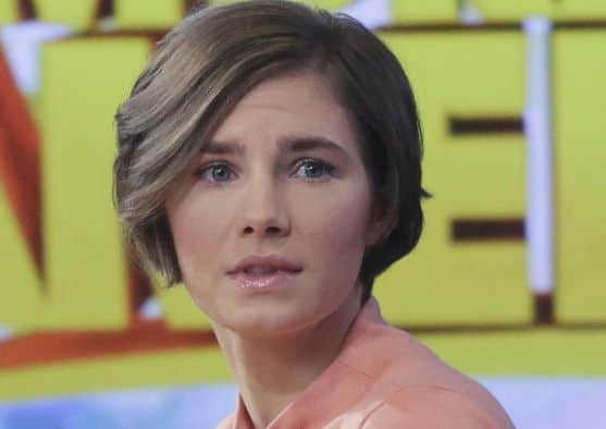 Amanda Knox prepares to leave the set following a television interview in New York