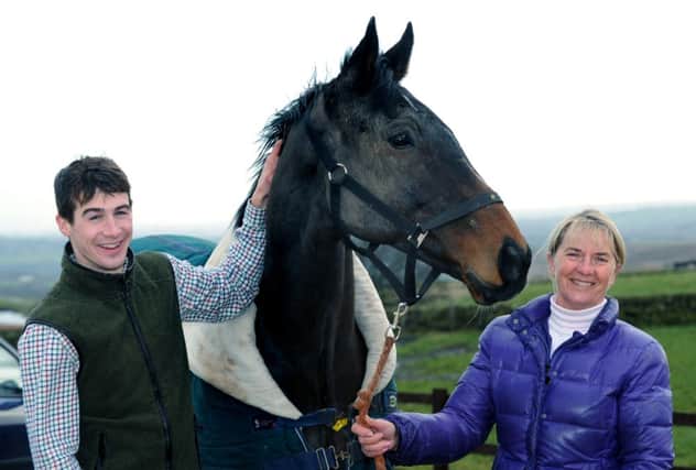 Sue Smith with Grand National winner Auroras Encore and jockey Ryan Mania, at the stables at High Eldwick.