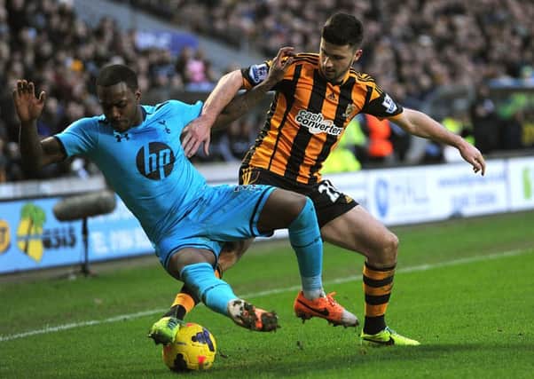 Hull City's Shane Long (right) and Tottenham Hotspur's Danny Rose battle for the ball.