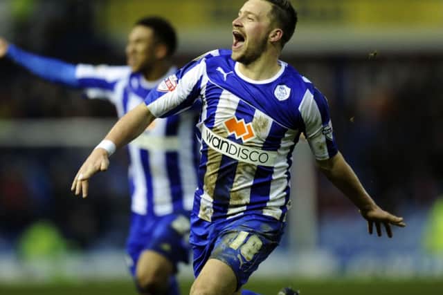 Chris Maguire celebrates his dramatic injury time winner
