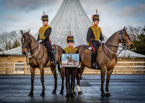 Lance Bombadier Emma Playford, Gunner Calum Pearson and Gunner Joshua Ratcliffe of The King's Troop Horse Artillery in Woolwich as they launch a new set of stamps entitled 'Working Horses'.