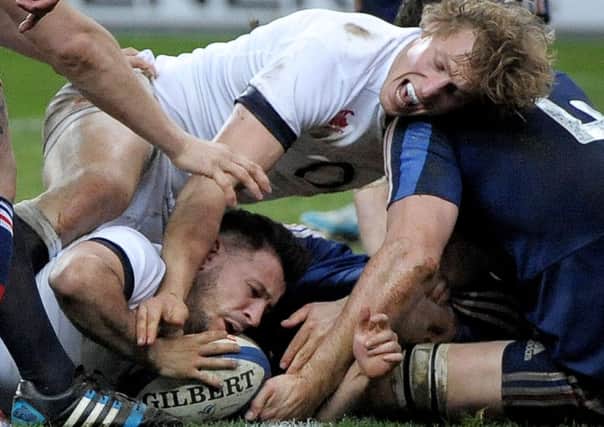 England's Danny Care and Billy Twelvetrees are held up to prevent a try during the RBS 6 Nations match at the Stade de France, Paris, France. (Picture: Tim Ireland/PA Wire).