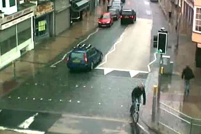 A man on a bike who police would like to speak to following the theft of a bag from pensioner Pamela Roddis