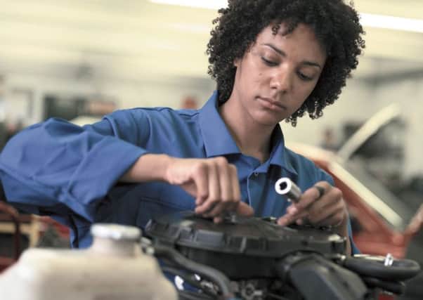 A female apprentice mechanic