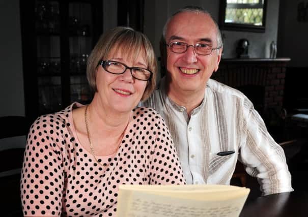 Julie and Stephen Ward with poems written by her dad, Maurice Crowther