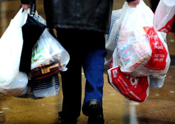 Ministers have made a "complete mess" of moves to introduce a 5p charge on carrier bags in England by making the scheme too complicated, MPs have warned.