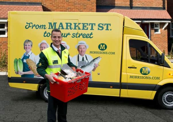 Dalton Philips with a Morrisons delivery van. Picture: Joel Chant