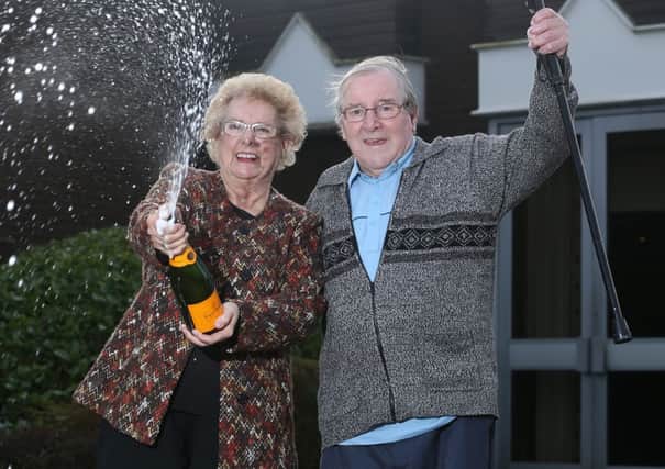 Marie and Roy Dean celebrate after winning the EuroMillions raffle draw