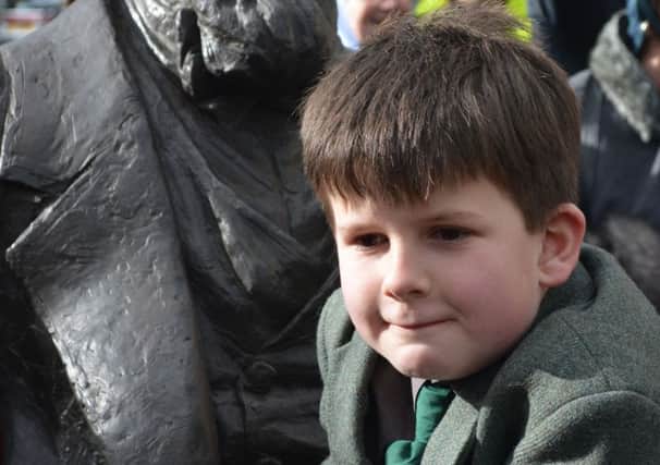 Oliver Dickens, aged nine, at the unveiling of the first statue in the UK of his great-great-great-grandfather Charles Dickens in Portsmouth