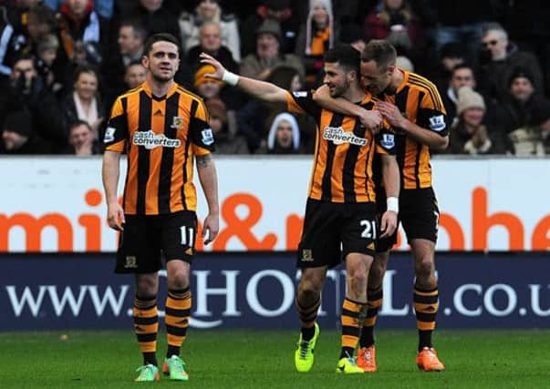 Hull City's Shane Long (centre) celebrates scoring his sides first goal of the game with teammate David Meyler (right).