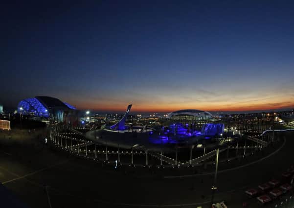 The sun sets over the Olympic Park before the opening ceremony of the 2014 Winter Olympics in Sochi, Russia