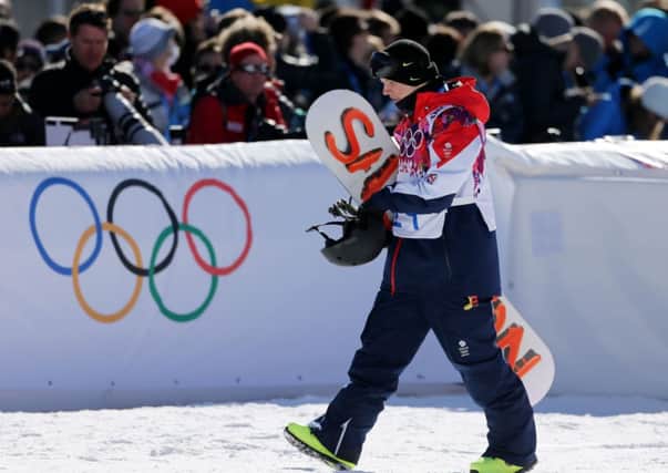 Great Britain's Jamie Nicholls reacts following his first run in the Men's Snowboard Slopestyle Final at the Rosa Khutor Extreme Park during the 2014 Sochi Olympic Games in Krasnaya Polyana, Russia.
