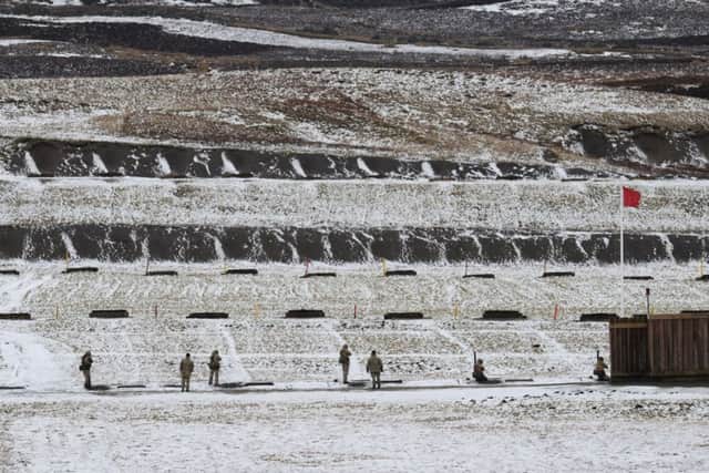 Soldiers train on the firing ranges at Leyburn in the Yorkshire Dales after a light covering of snow.