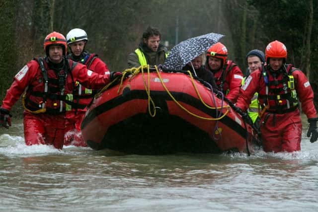 Berkshire firefighters rescue Joy Levinson from her house on Magna Carta Lane in Wraysbury, Berkshire.