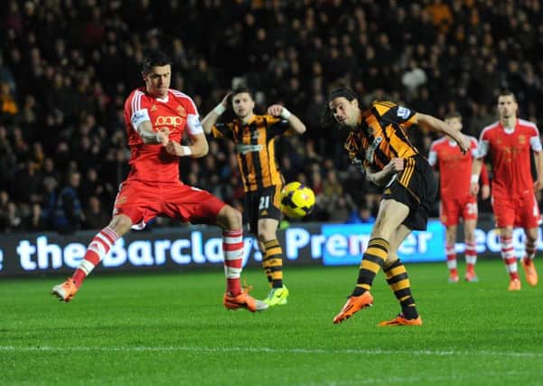 Hull City's George Boyd has a shot on goal against Southampton.