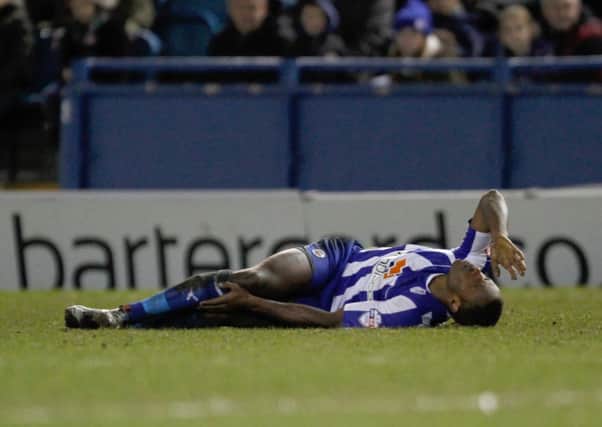 Sheffield Wednesday's Jose Semedo lies injured during last night's game.