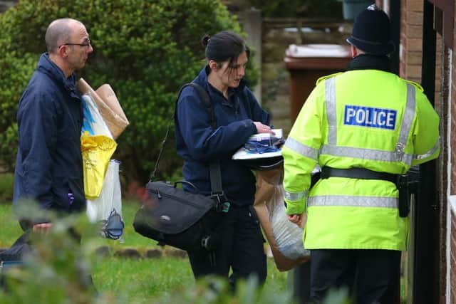 Police forensic officers arrive at a house on Emily Street in Blackburn, Lancashire, after an eleven month old baby girl died when she was mauled by a pet dog.