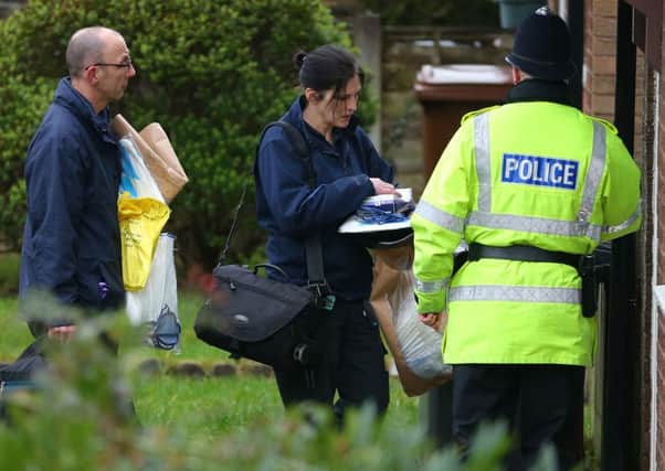 Police forensic officers arrive at a house on Emily Street in Blackburn, Lancashire, after an eleven month old baby girl died when she was mauled by a pet dog.